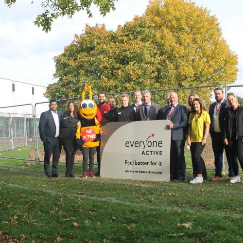 Hartham Leisure Centre contract award - A group of people standing next to ground works and 'Everyone Active' sign